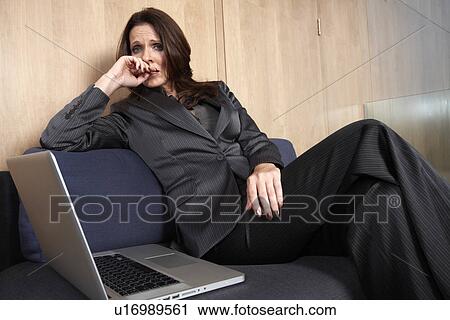 Stock Image - Depressed business woman. Fotosearch