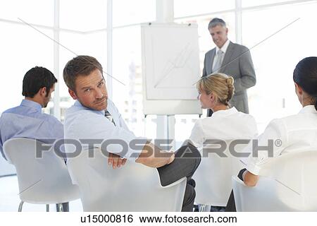 Stock Photograph - Depressed young employee. Fotosearch