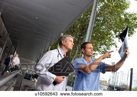 Stock Image - Doctor and radiologist. Fotosearch