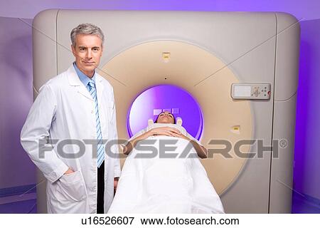 Doctor doing tomography View Large Photo Image Stock Photo - Doctor doing tomography. Fotosearch