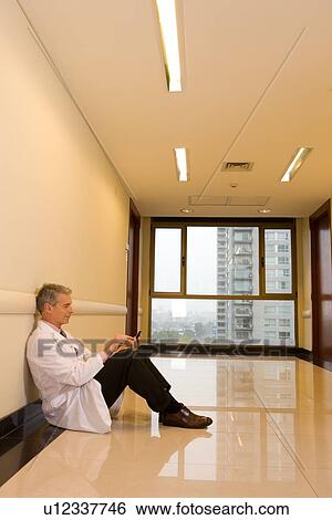 Stock Photograph - Doctor having a break. Fotosearch