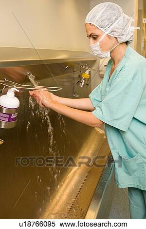 Stock Photography - Doctor washing hands. Fotosearch