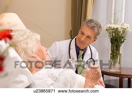 Doctor with a patient View Large Photo Image Stock Image - Doctor with a patient. Fotosearch