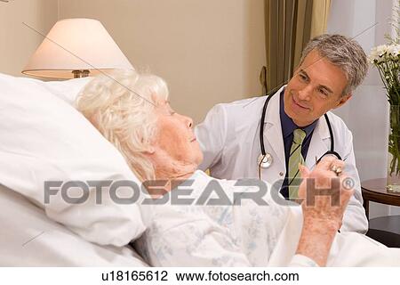 Doctor with a senior patient View Large Photo Image Stock Image - Doctor with a senior patient. Fotosearch