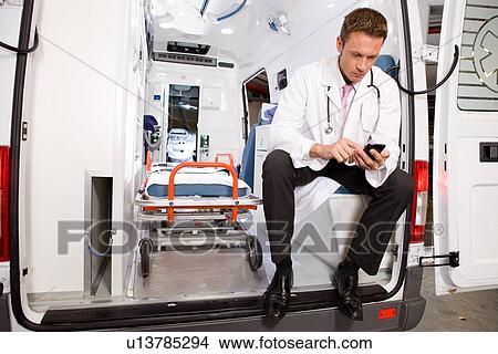 Picture - Doctor writing sms. Fotosearch