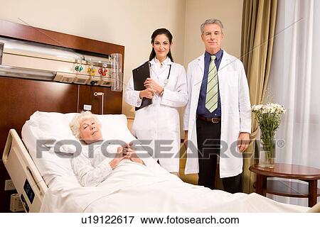 Stock Photo - Doctors and patient portrait. Fotosearch