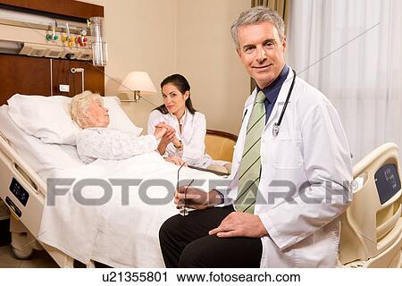 Doctors at work View Large Photo Image Stock Image - Doctors at work. Fotosearch