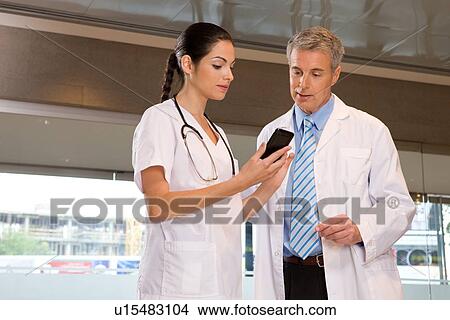 Doctors Consulting View Large Photo Image Picture - Doctors Consulting. Fotosearch