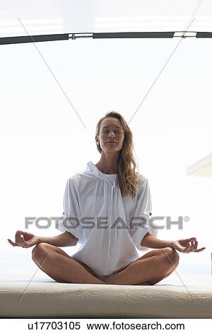 Stock Photography - Doing yoga. Fotosearch