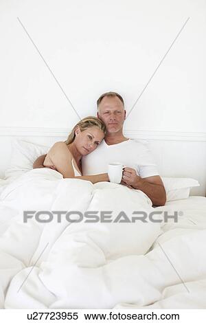 Drinking coffee in the bed View Large Photo Image Stock Photography - Drinking coffee in the bed. Fotosearch