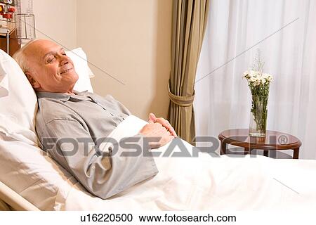 Stock Image - Elderly in bed. Fotosearch