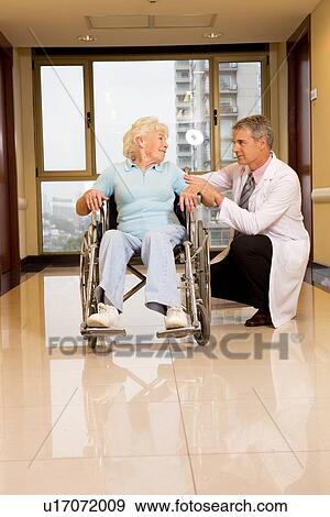 Elderly woman in a wheelchair View Large Photo Image Stock Photo - Elderly woman in a wheelchair. Fotosearch