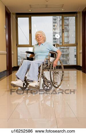Elderly woman in a wheelchair View Large Photo Image Stock Photograph - Elderly woman in a wheelchair. Fotosearch