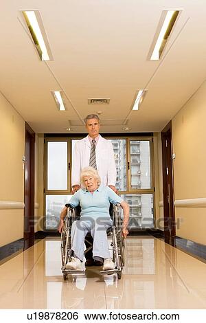 Stock Photograph - Elderly woman in a wheelchair. Fotosearch