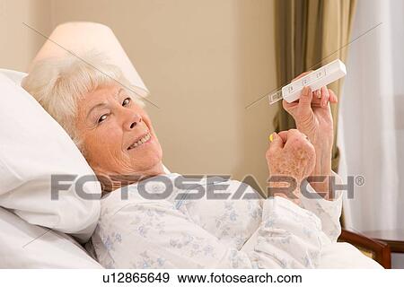 Elderly woman taking medicine View Large Photo Image Stock Photo - Elderly woman taking medicine. Fotosearch
