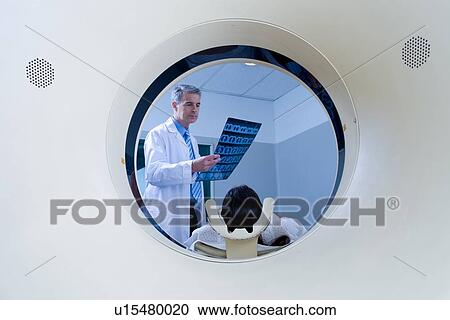 Examining a brain scan View Large Photo Image Stock Image - Examining a brain scan. Fotosearch