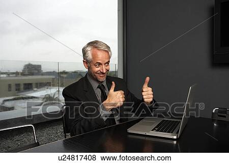 Executive doing OK sign View Large Photo Image Stock Photo - Executive doing OK sign. Fotosearch