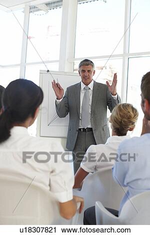 Stock Image - Executive presenting. Fotosearch