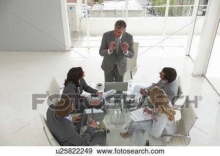 Executive presenting to his team View Large Photo Image Stock Photo - Executive presenting to his team. Fotosearch