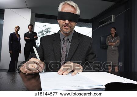 Executive signing a contract View Large Photo Image Stock Photo - Executive signing a contract. Fotosearch