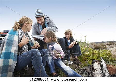 Family having a break View Large Photo Image Stock Image - Family having a break. Fotosearch