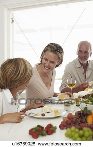 Family having a meal View Large Photo Image Stock Photography - Family having a meal. Fotosearch