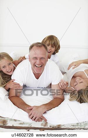 Stock Photo - Family having fun. Fotosearch