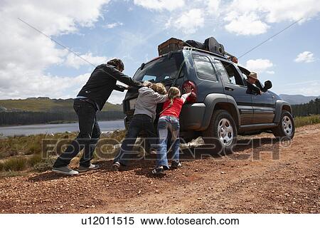 Family pushing a car View Large Photo Image Stock Photography - Family pushing a car. Fotosearch