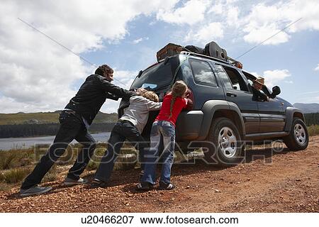 kids pushing car