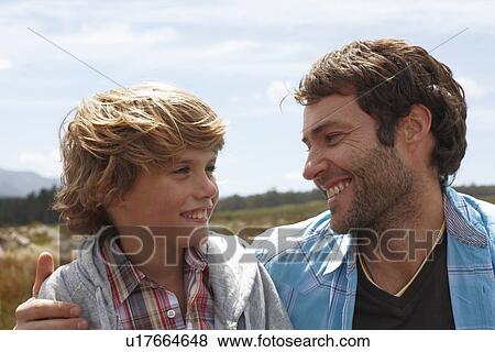 Stock Photo - Father and son in the countryside. Fotosearch