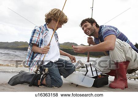 Father and son on a fishing trip View Large Photo Image Stock Photo - Father and son on a fishing trip. Fotosearch