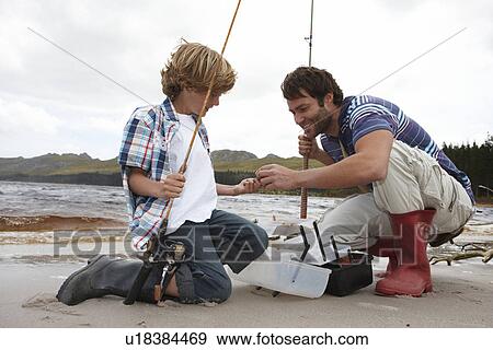 Father and son on a fishing trip View Large Photo Image Stock Photo - Father and son on a fishing trip. Fotosearch