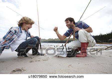 Father and son outdoors View Large Photo Image Stock Image - Father and son outdoors. Fotosearch