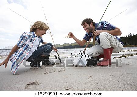 Father and son playing View Large Photo Image Stock Image - Father and son playing. Fotosearch
