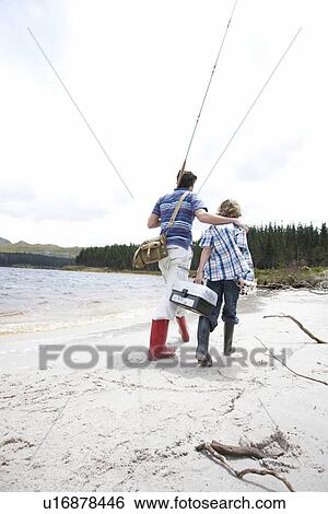 Stock Photograph - Father and son walking. Fotosearch