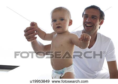 Stock Photo - Father with his baby. Fotosearch