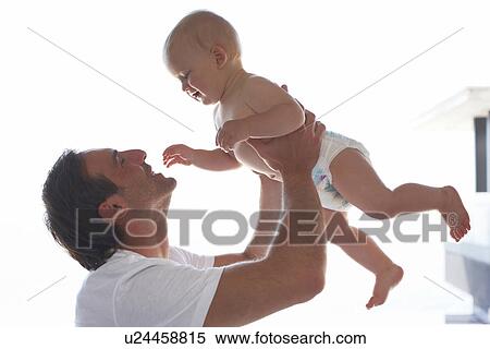 Father with his baby View Large Photo Image Stock Photography - Father with his baby. Fotosearch
