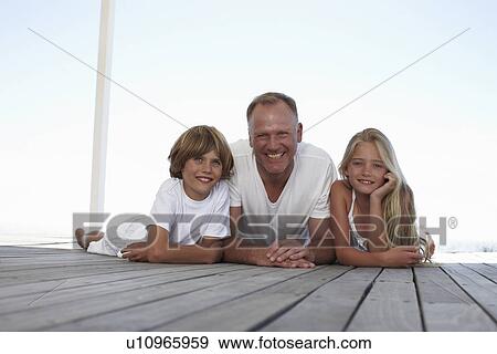 Stock Photo - Father with his kids. Fotosearch