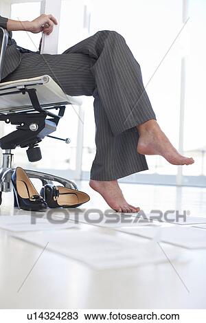 Stock Image - Feet of a business woman. Fotosearch