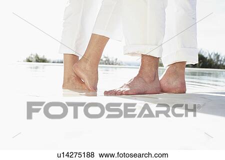 Stock Photo - Feet of a couple in love. Fotosearch