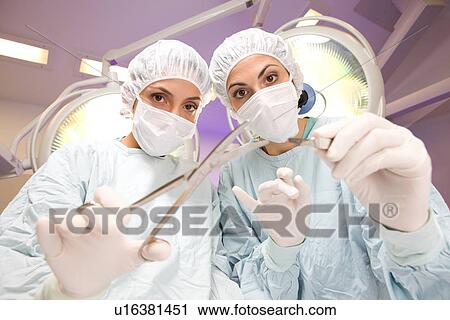 Stock Image - Female surgeons. Fotosearch