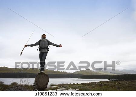 Stock Image - Fisherman enjoying fresh air. Fotosearch