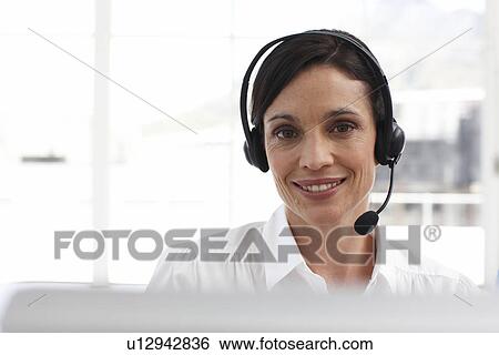 Stock Photograph - Friendly customer support agent. Fotosearch