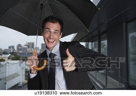Funny man in the rain View Large Photo Image Stock Image - Funny man in the rain. Fotosearch