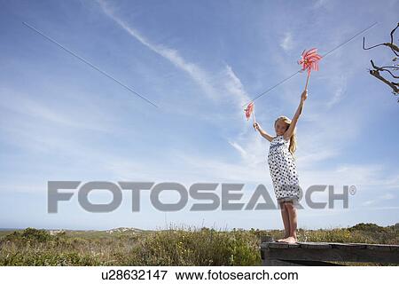Girl in the field View Large Photo Image Stock Photo - Girl in the field. Fotosearch