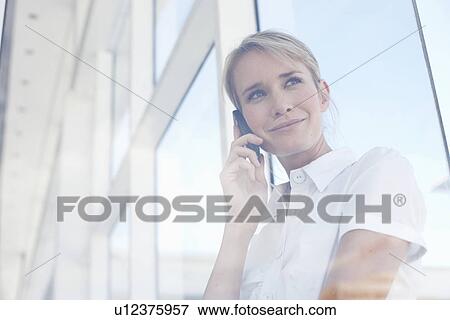 Girl on a phone View Large Photo Image Stock Photo - Girl on a phone. Fotosearch