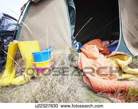 Girl sleeping in a tent View Large Photo Image Stock Image - Girl sleeping in a tent. Fotosearch