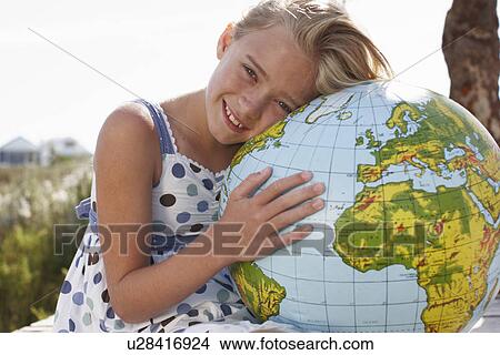 Picture - Girl with a globe. Fotosearch