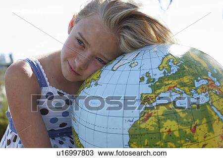 Stock Image - Girl with a globe. Fotosearch