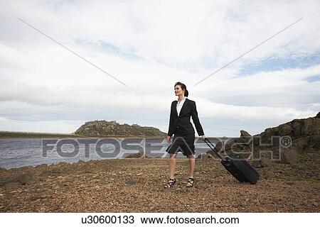 Stock Image - Girl with a luggage. Fotosearch